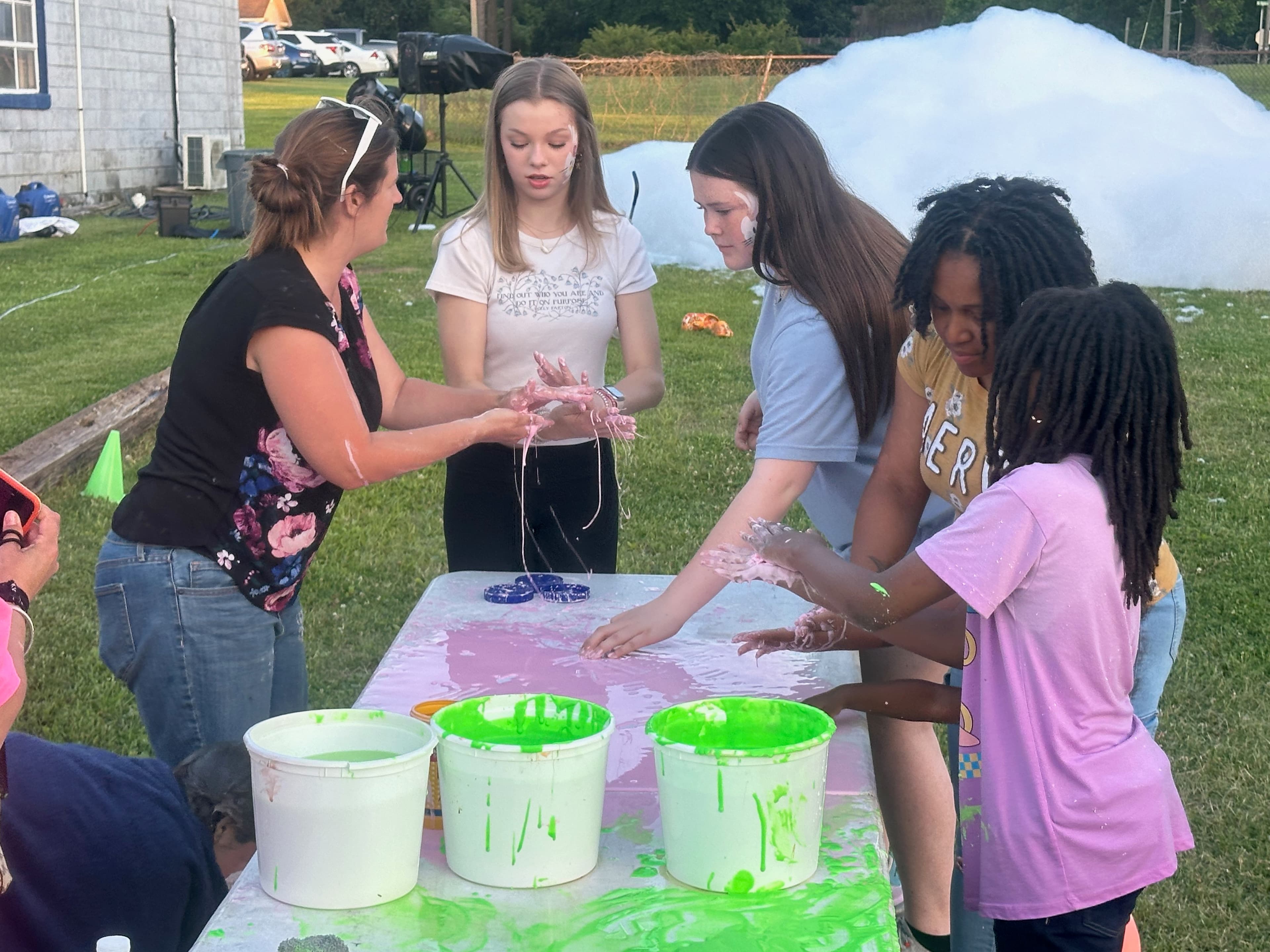 Kids enjoying a sensory-friendly slime activity at a table